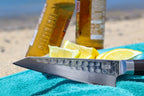 Couteau Santoku Bunka Damas Kotai Réunion, découpe citron